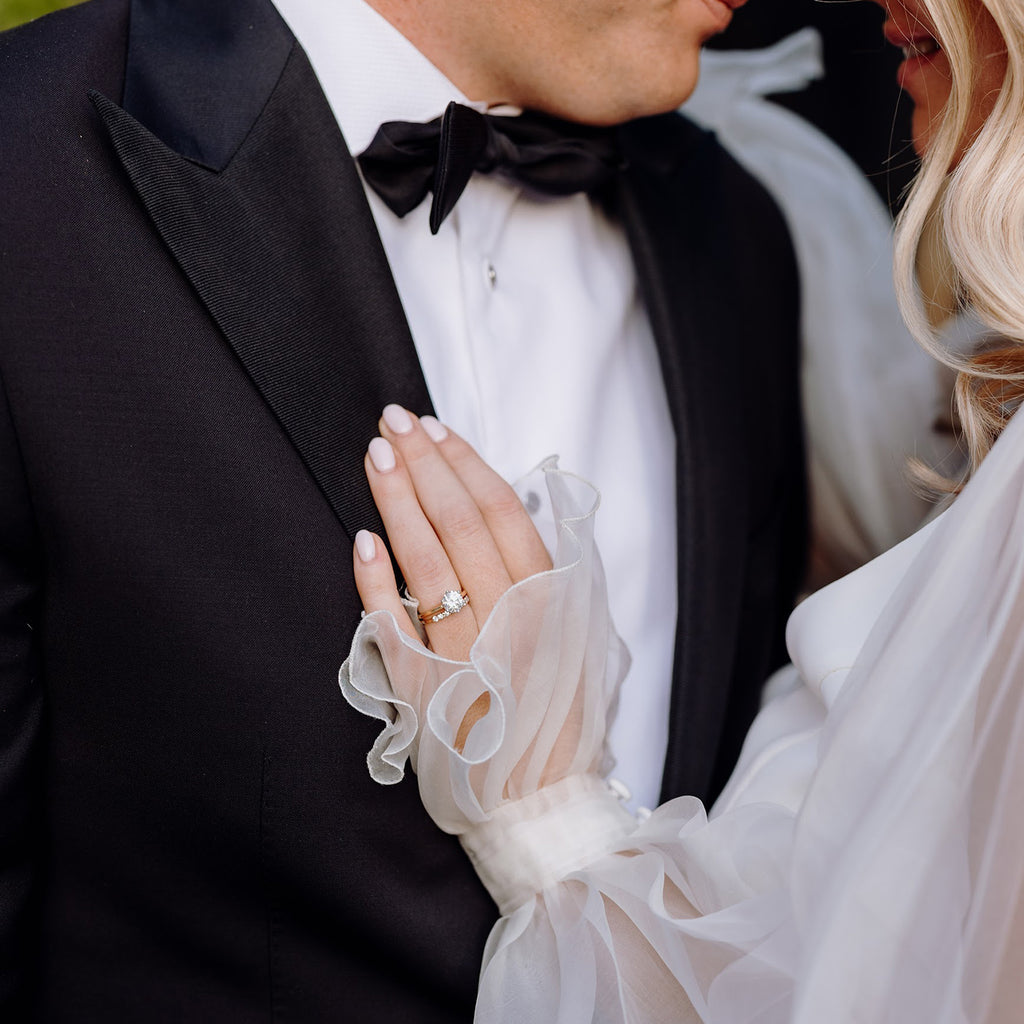Bride and groom on wedding day, bride wearing diamond engagement and wedding rings