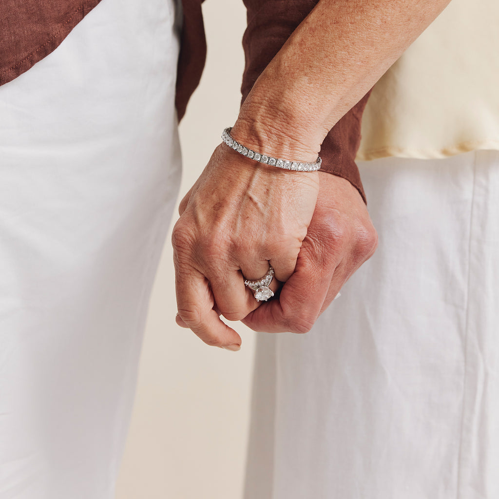 Couple holding hands with female wearing diamond Jubilee bracelet