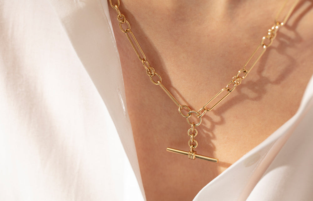 Model wearing yellow gold fob chain