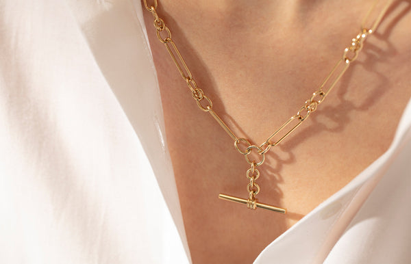 Model wearing yellow gold fob chain