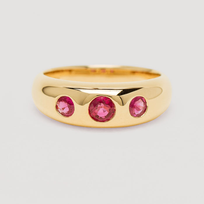 Yellow gold ruby Kylie Ring on light grey background