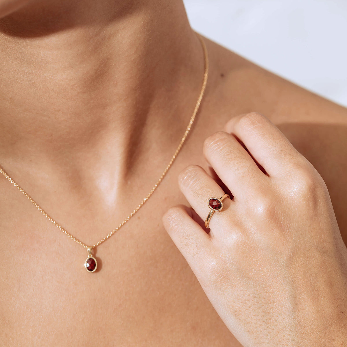 Model wearing Garnet Essence Ring and Pendant
