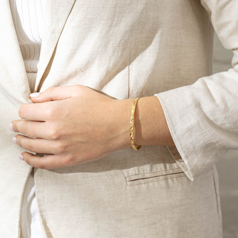 Deja Vu 14ct Yellow Gold Engraved Bangle - Walker & Hall