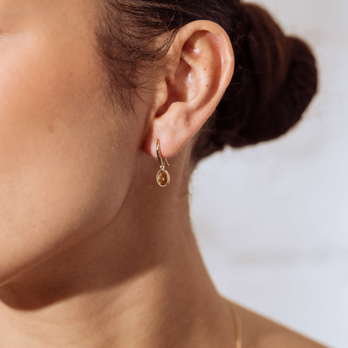 Close up of model wearing Citrine Essence Earring