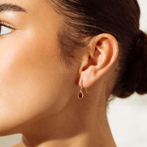 Model wearing Garnet Essence Earrings