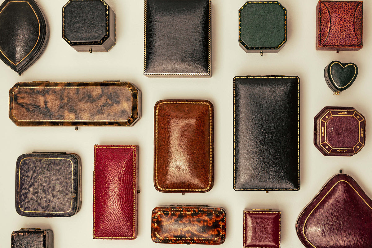 Flat lay of vintage jewellery and ring boxes