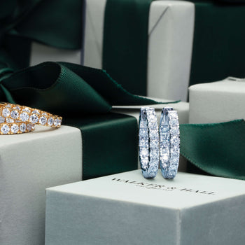 Diamond Jubilee Hoop Earrings on a Walker & Hall gift box with green ribbon