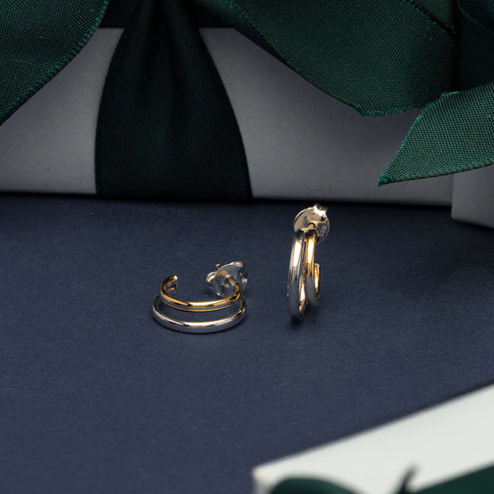 9ct yellow gold and sterling silver Gemma Earrings with gift wrapped boxes behind