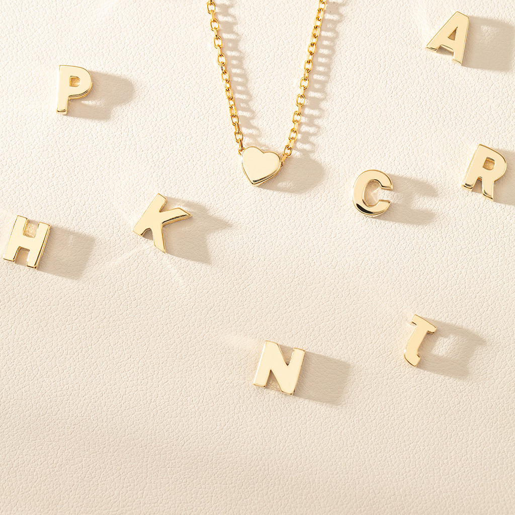 9ct yellow gold Noted letter pendants