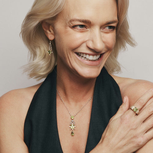 Model wearing Vintage peridot and pearl necklace and earrings