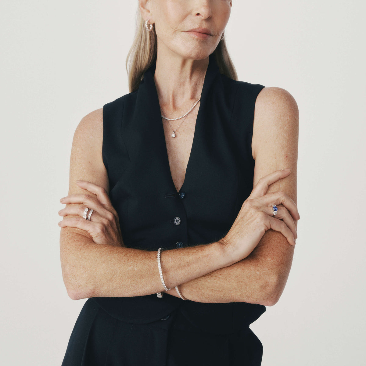 Model wearing selection of Natural Diamond and Gemstone Jewellery from the 1899 Collection