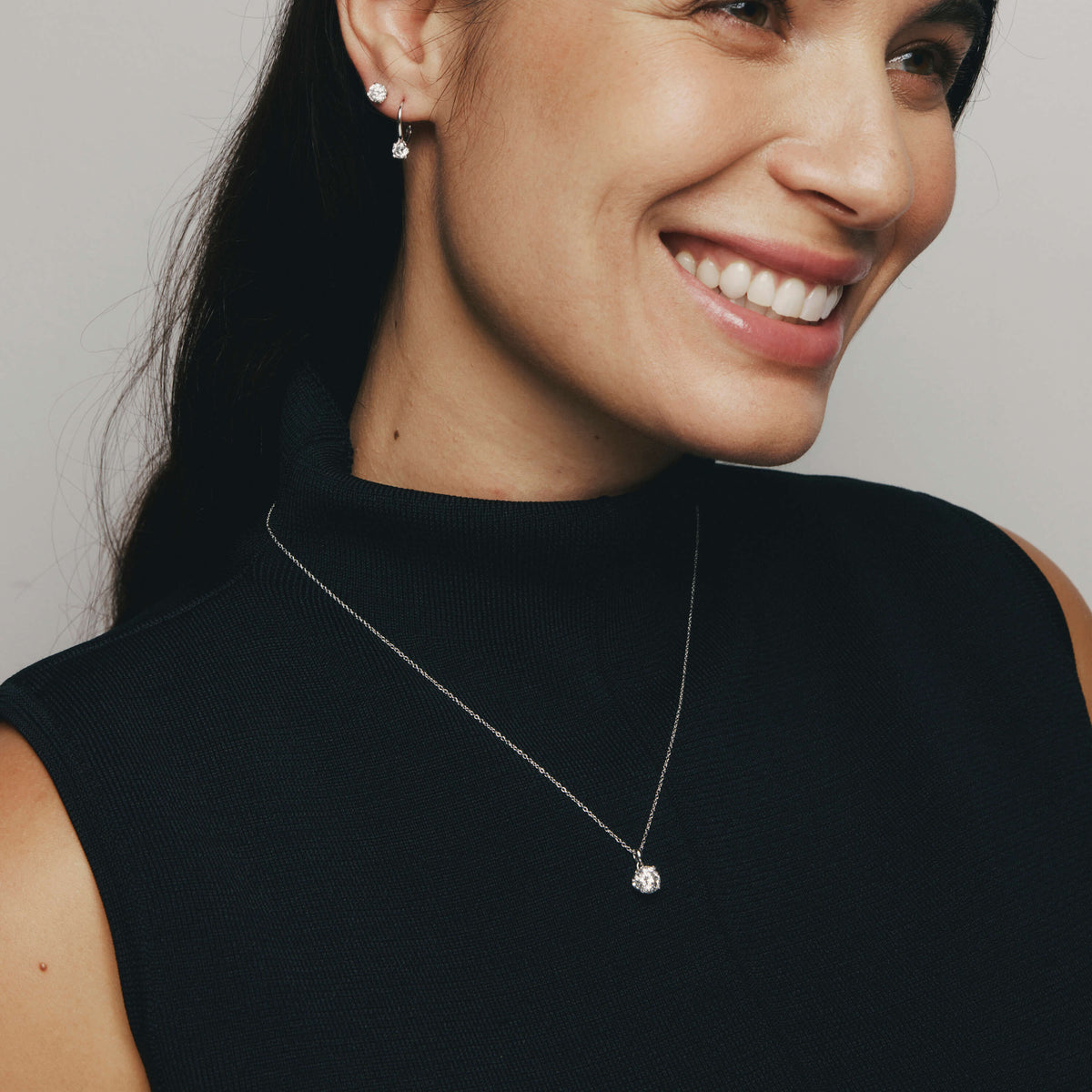 Model wearing Natural Diamond Blossom Pendant, Stud Earring and Drop Earrings