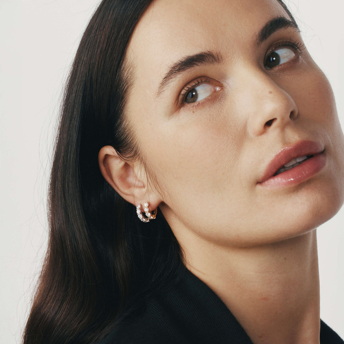 Close-up of a woman wearing Diamond Panorama Earrings