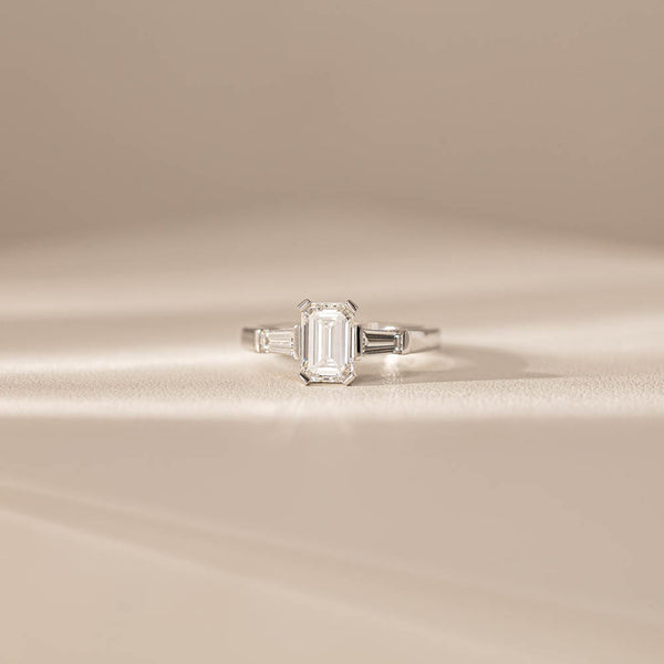 18ct White Gold 1.51ct Emerald Cut Diamond Three Stone Ring - Ring - Walker & Hall